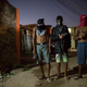 “Young drug traffickers pose for photos holding their guns at a slum in Rio de Janeiro, Brazil.”